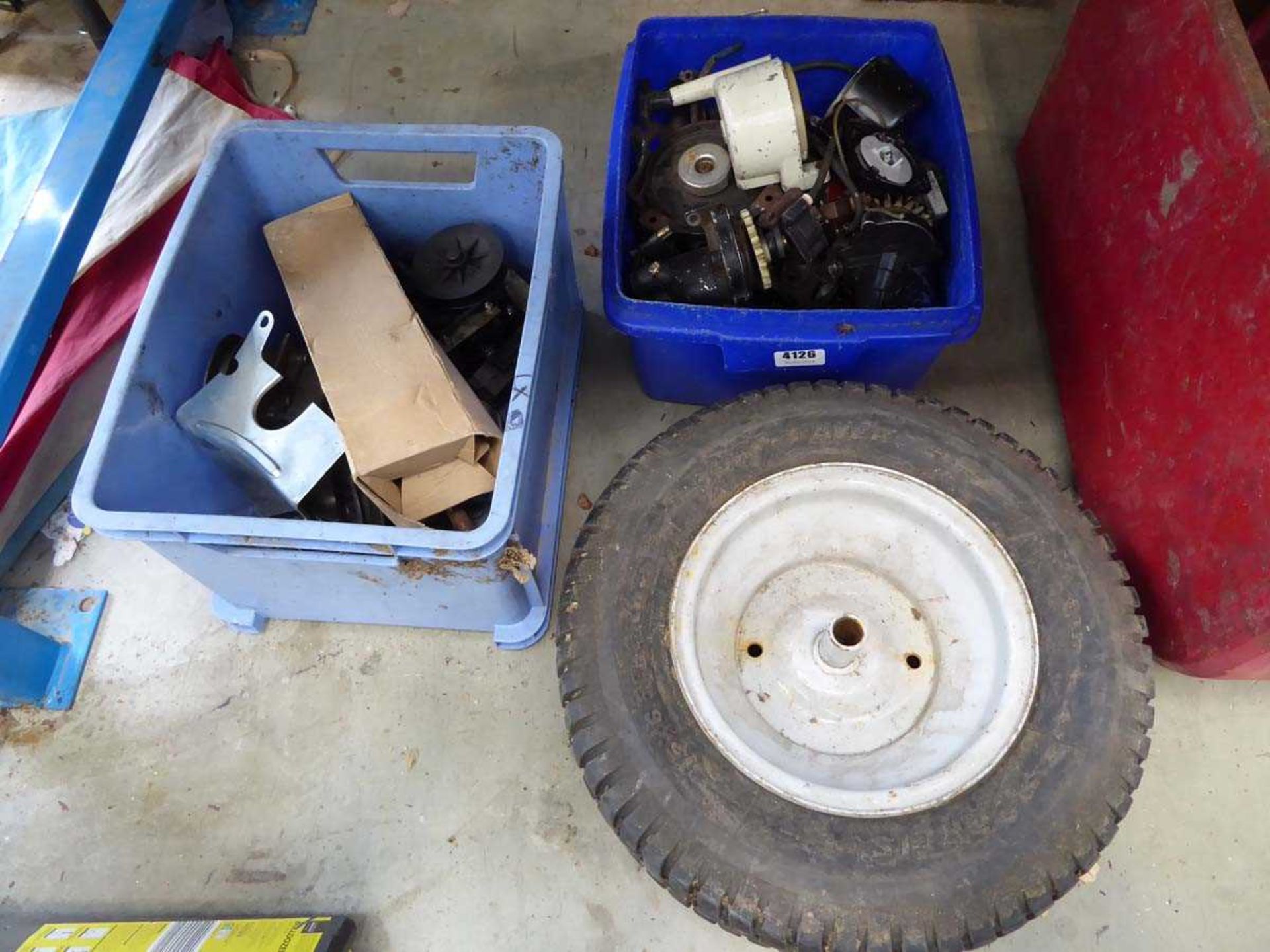 Lawn mower wheel and 2 boxes of spares