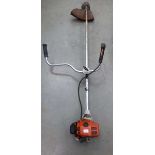 Stihl double handed petrol powered strimmer