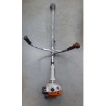 Stihl petrol powered double handed strimmer