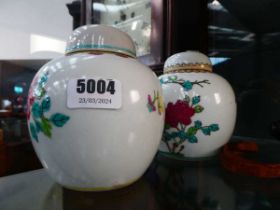 Two rose patterned ginger jars
