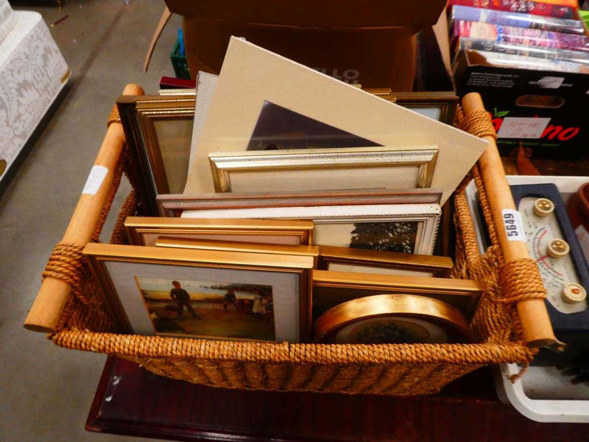 Wicker basket containing prints