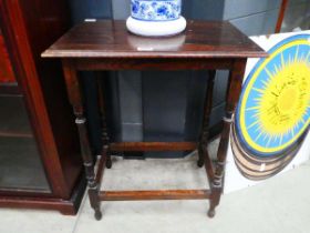 Oak side table with stretchers