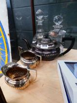 Two decanters with silver-plated labels, silver-plated teapot, jug and sugar bowl