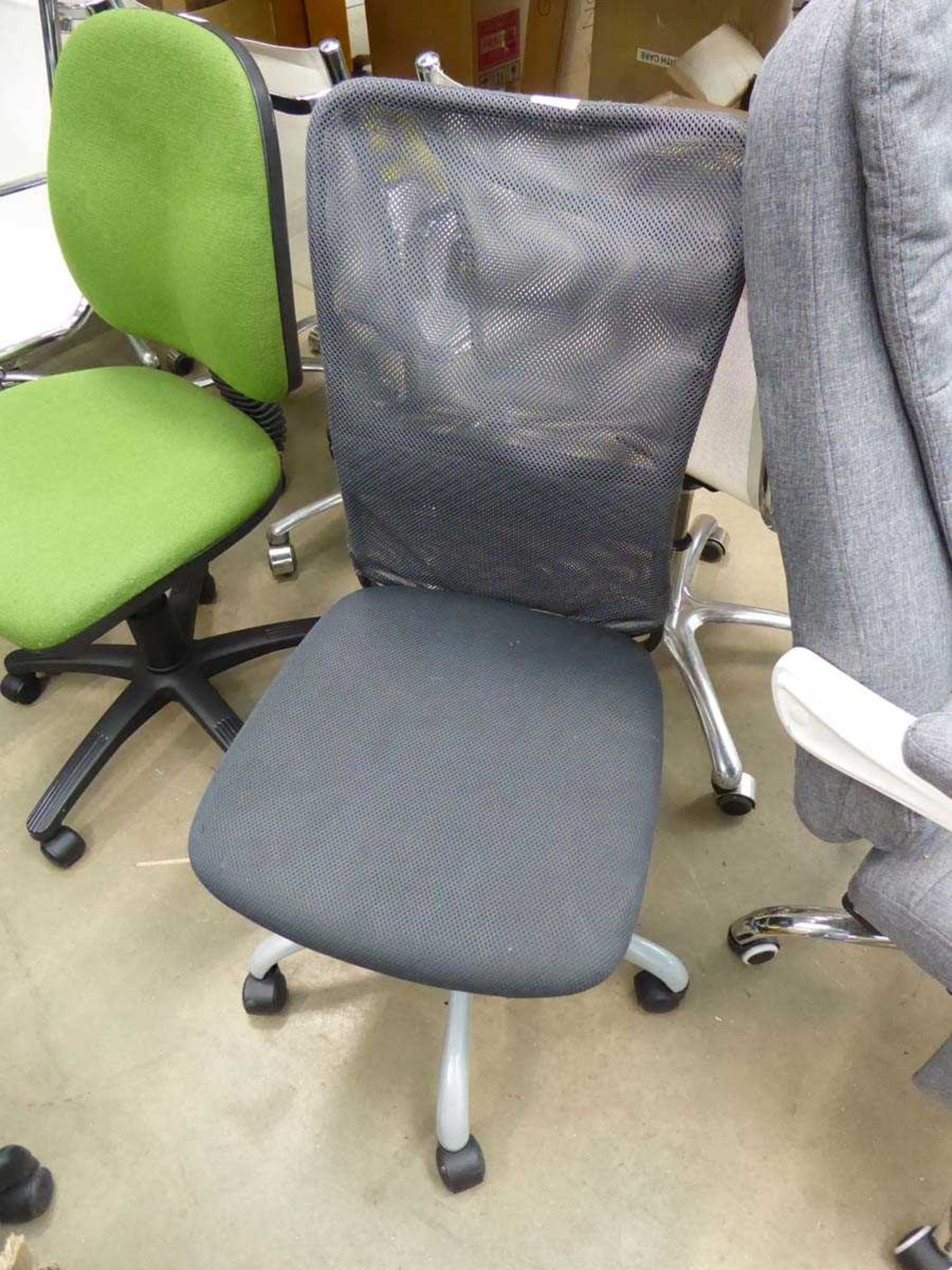 Mesh office operators chair on grey base