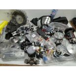 +VAT Large box containing vehicles spare parts including wing mirrors, wheel nuts, wheel hubs,