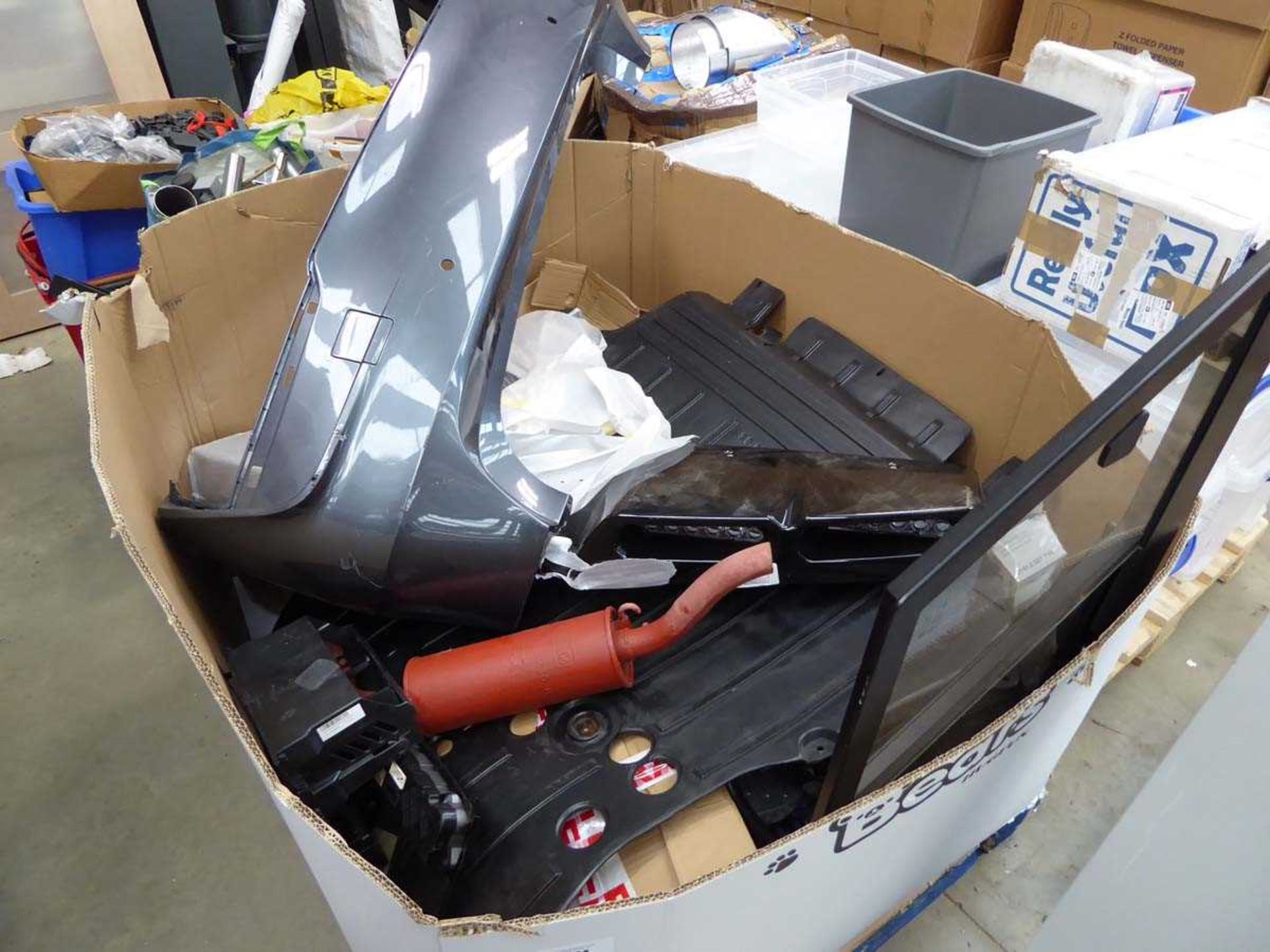 +VAT Pallet of assorted car parts, to include headlights, bumpers, trim etc.