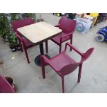 Slattted wood effect bistro table with 3 purple stacking plastic chairs