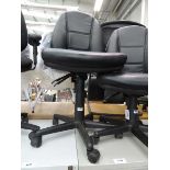 Black office operators chair on black base