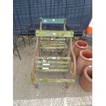 Pair of slatted wood wrought iron ended garden seats in green