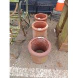 3 small terracotta chimney pots