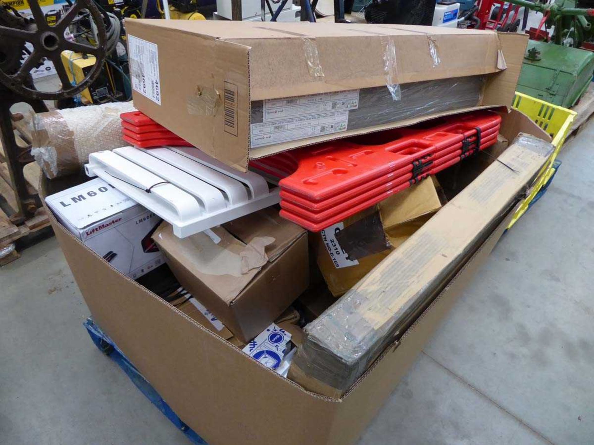 +VAT Pallet of assorted items to include large rolls of paper, radiators and other sundry items
