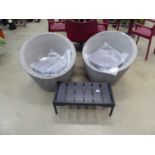 2 grey plastic rattan tub chairs and a metal coffee table in black