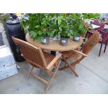 Round wooden garden table, and 4 wooden fold up garden chairs