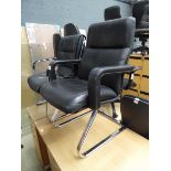 2 x black office slide chairs on chrome bases