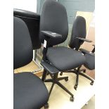 Black cloth operators swivel armchair on black base