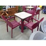 Slattted wood effect bistro table with 3 purple stacking plastic chairs