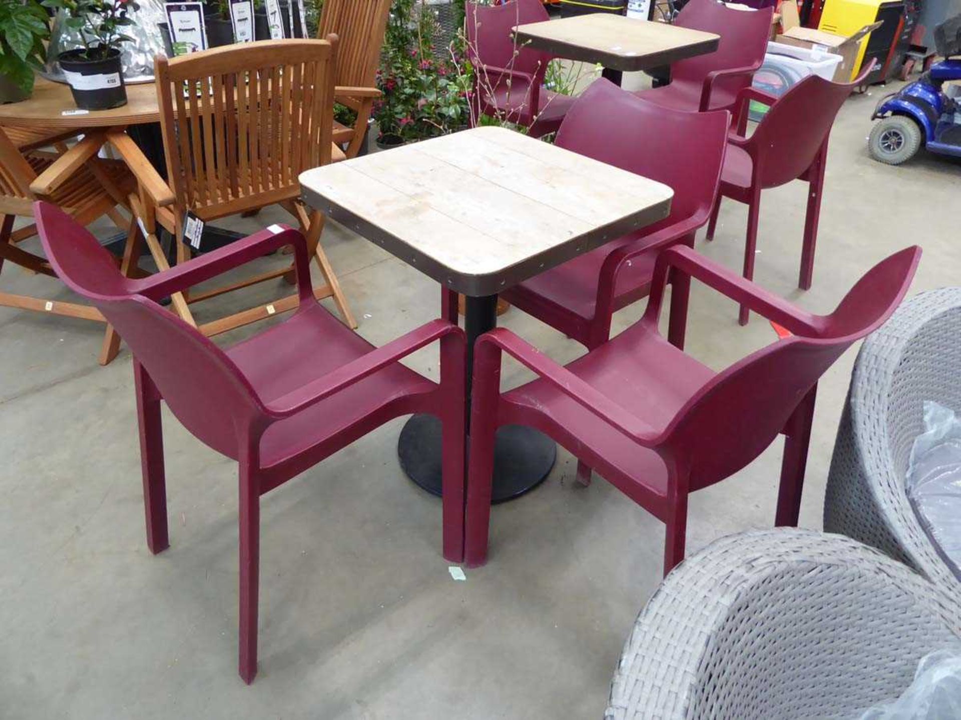 Slattted wood effect bistro table with 3 purple stacking plastic chairs