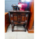 Dark oak pot cupboard with linen fold panels