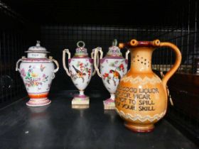 Royal Doulton puzzle jug, plus three bird and floral patterned lidded urns