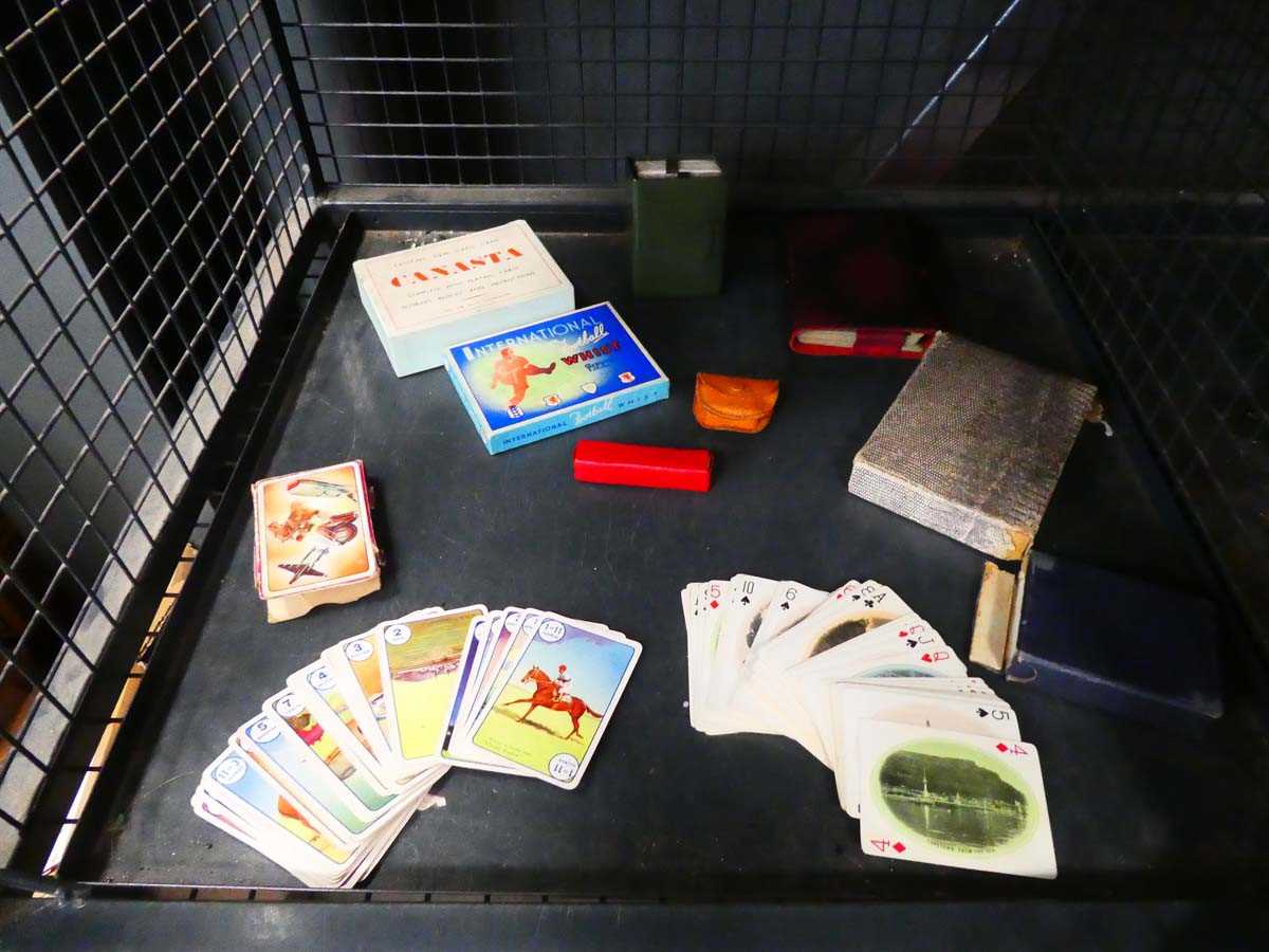Cage containing playing cards