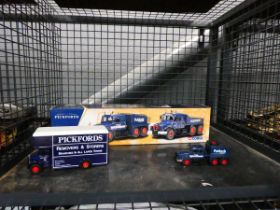 Cage containing two Pickford vans, plus a boxed lorry set