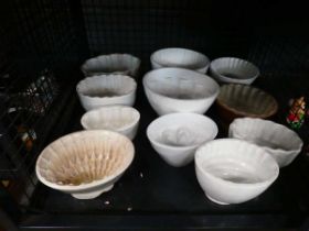 Cage containing collection of jelly moulds