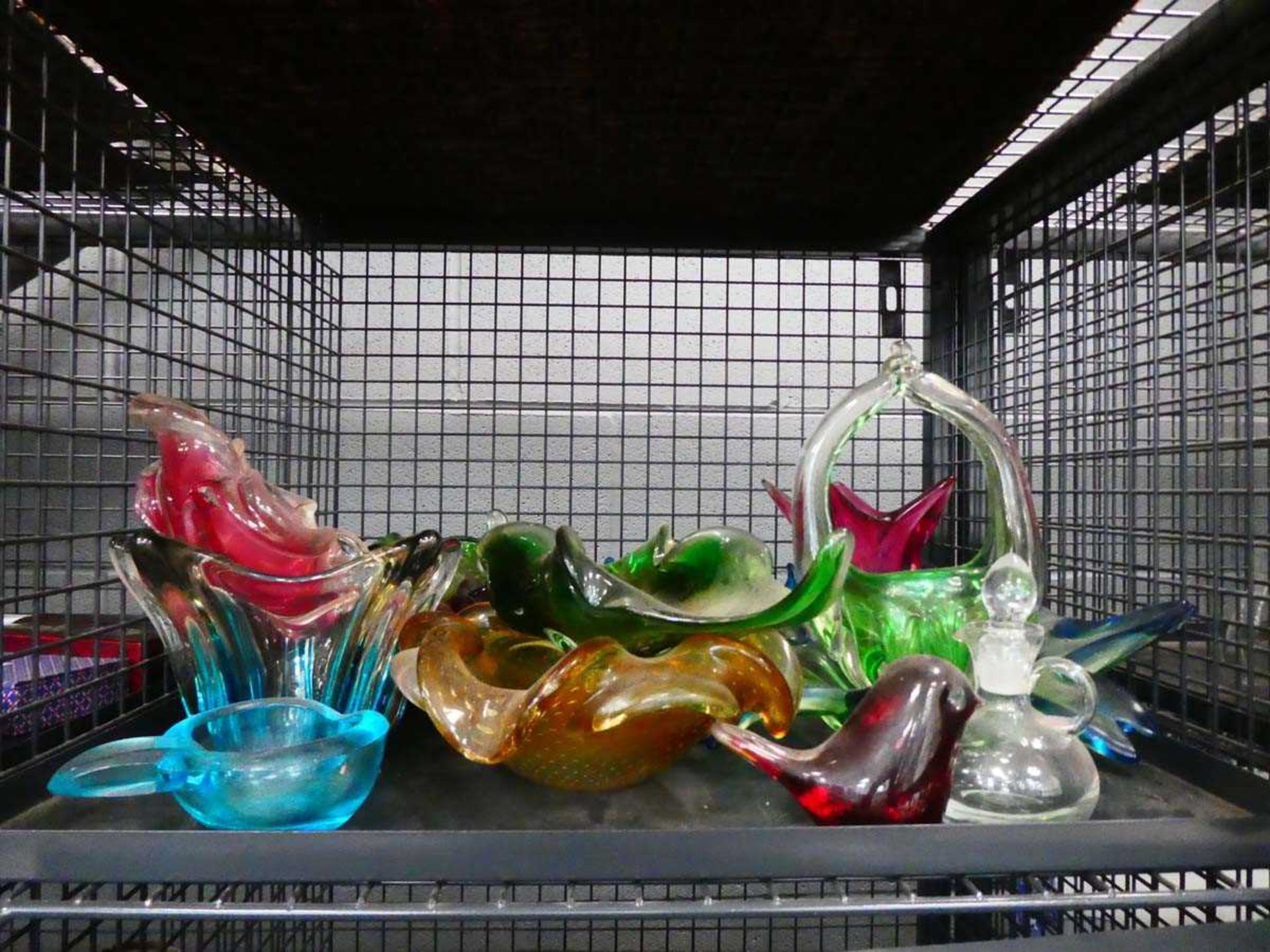 Cage containing glass bowls and baskets