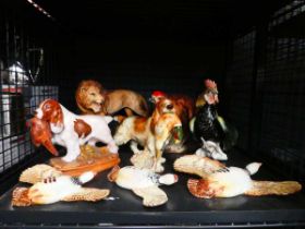 Cage containing three Beswick wall partridge, plus gun dogs and figure of a lion
