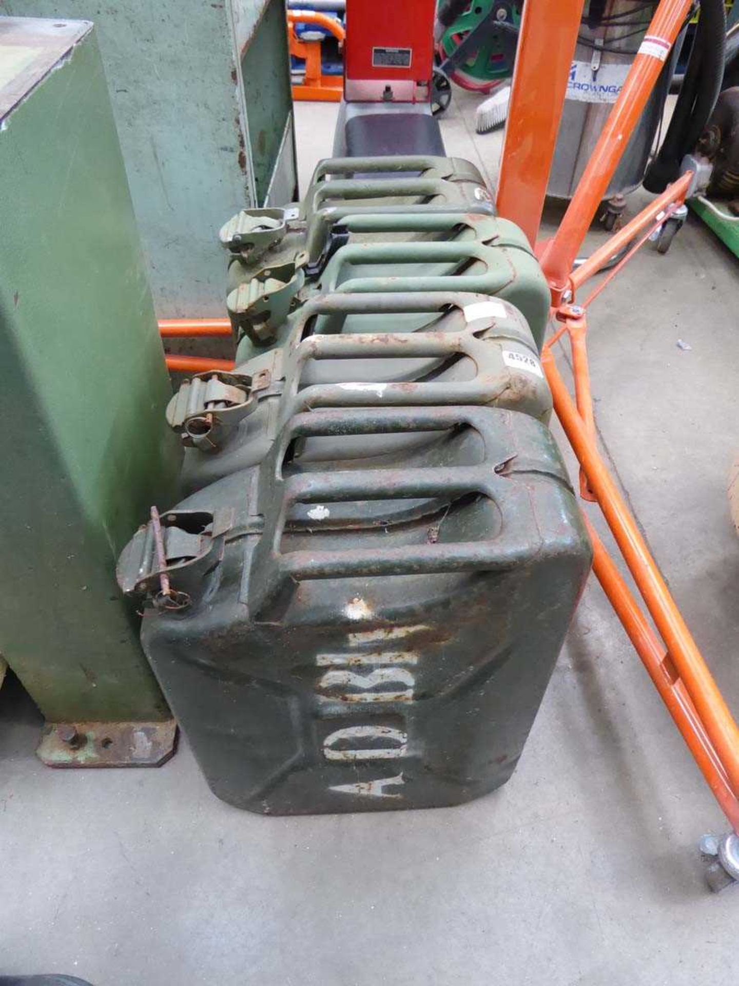 Four metal jerry cans