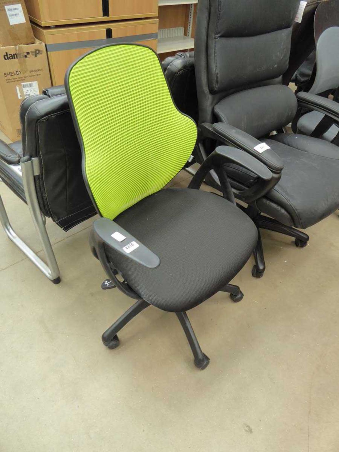 Black cloth lime green mesh back swivel armchair