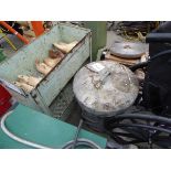 Small metal rack with shoe lasts and a galvanised bin