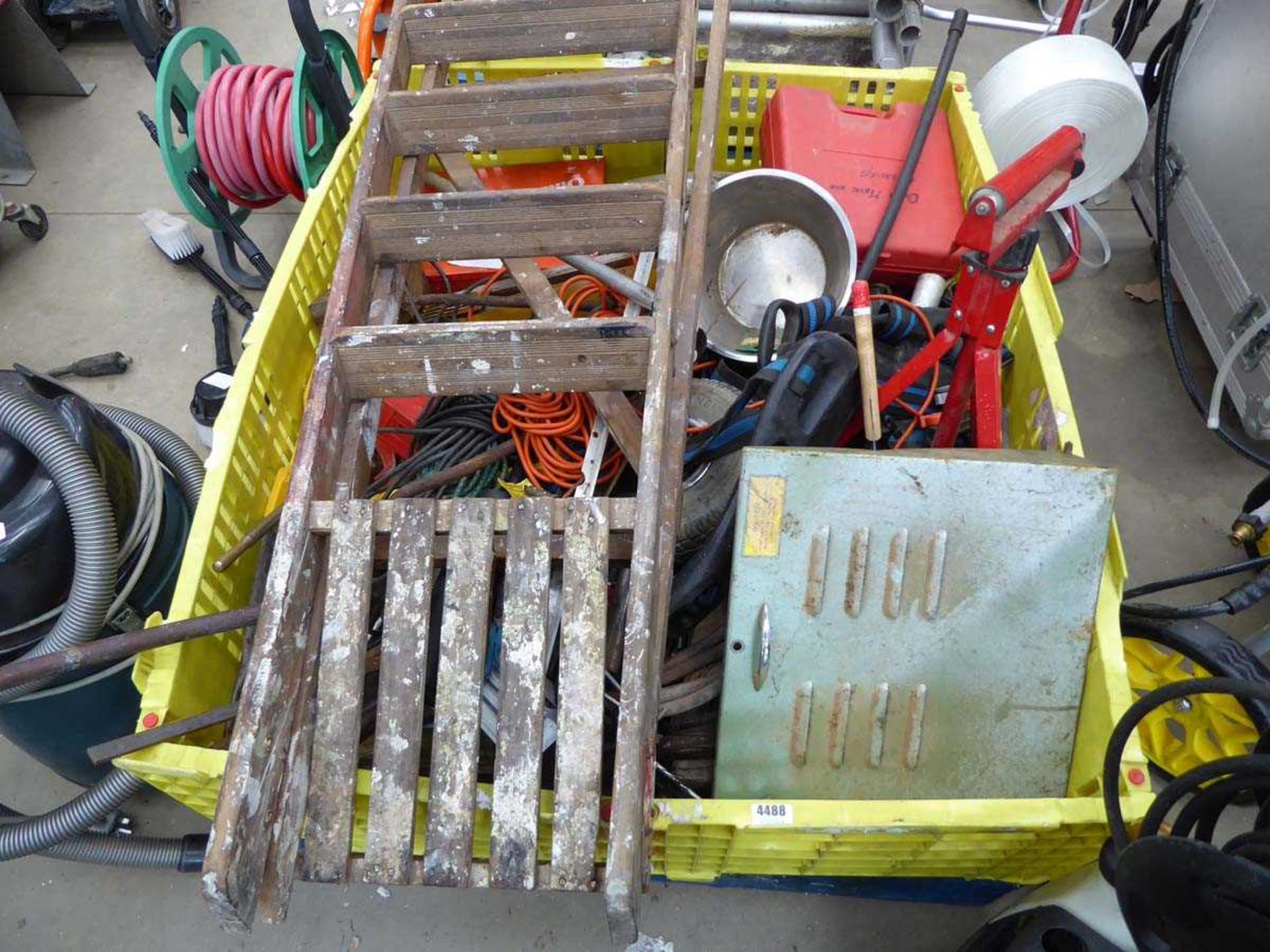 Large pallet box containing a step ladder, cables, bungee, rollerball stand, machine parts etc