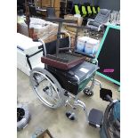 Black wheelchair and stool