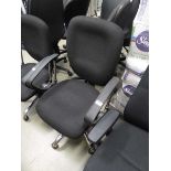 Black cloth swivel armchair