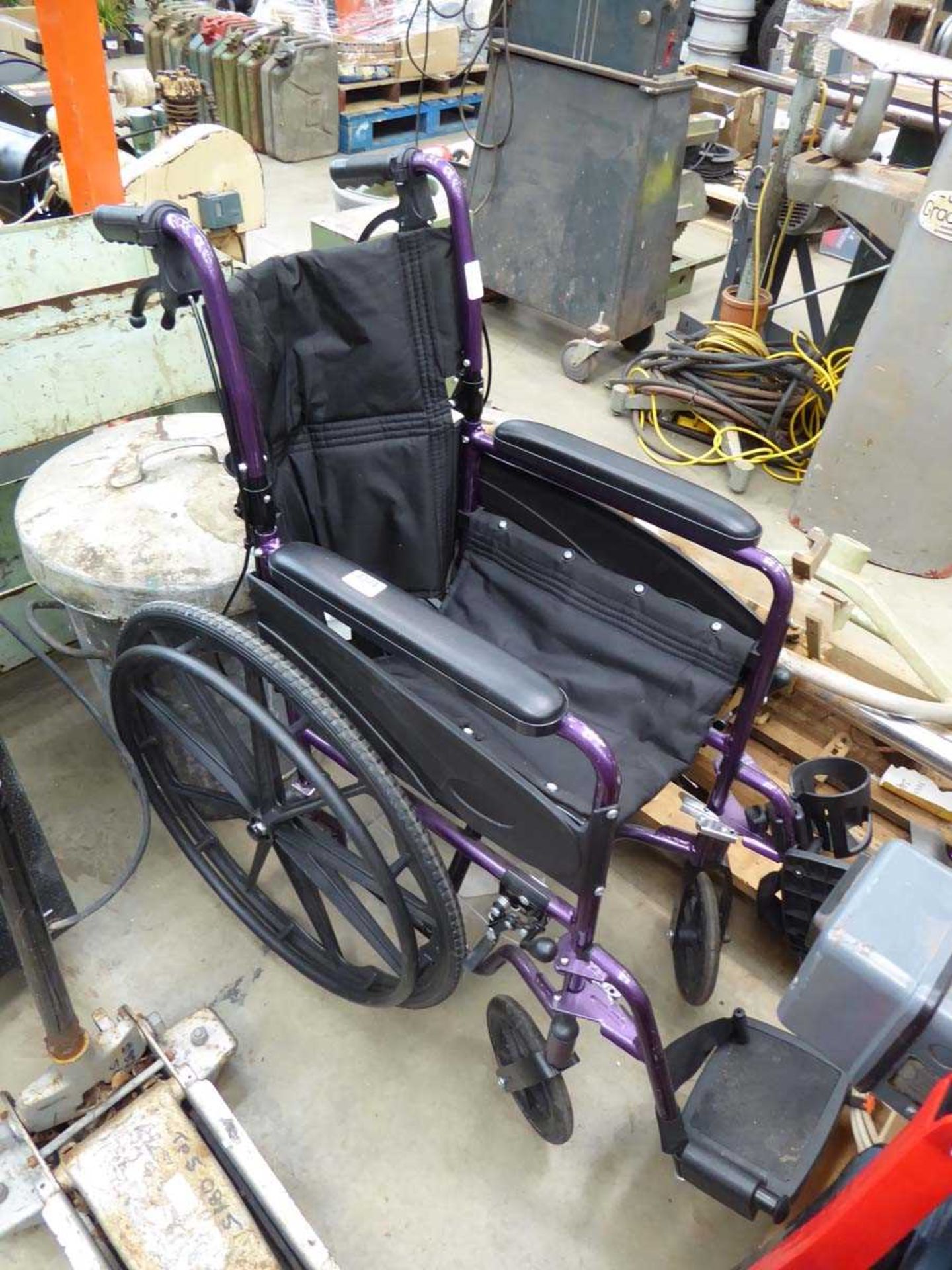 Fold up purple wheelchair