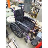 Fold up purple wheelchair