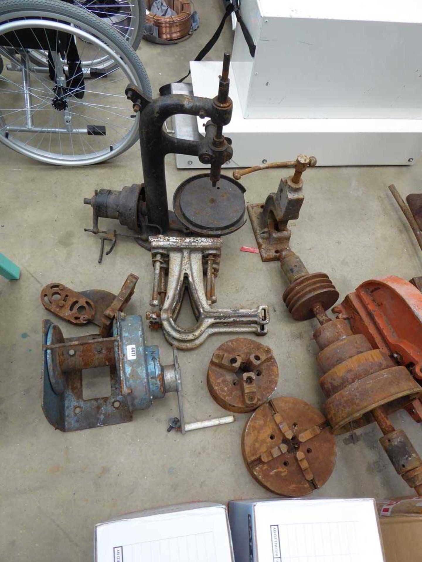 Two machine chucks, a quantity of machine parts, small press and other metal parts