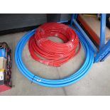 Three lengths of red hose, plus alkathene pipe