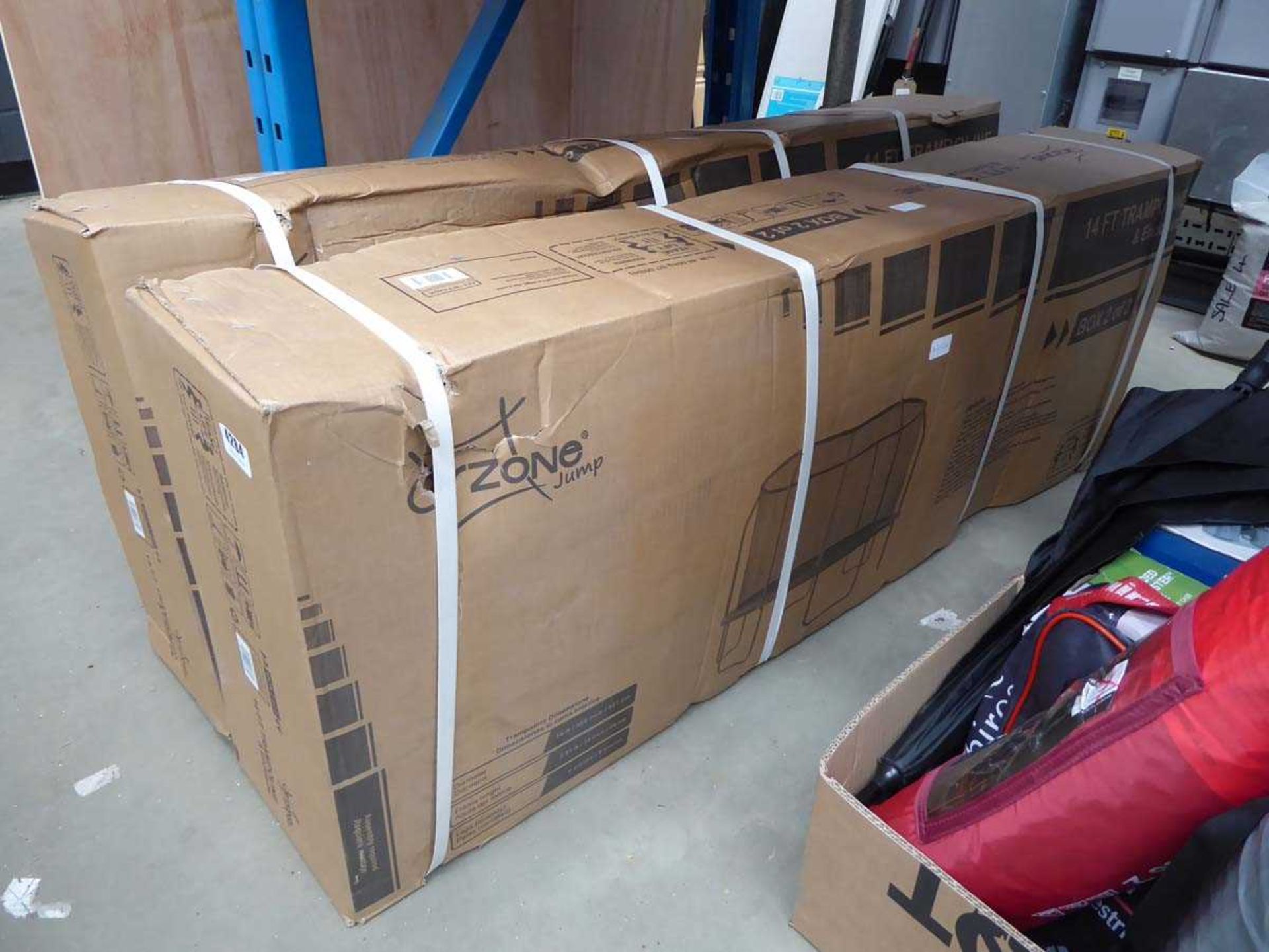 Two boxes containing trampoline parts