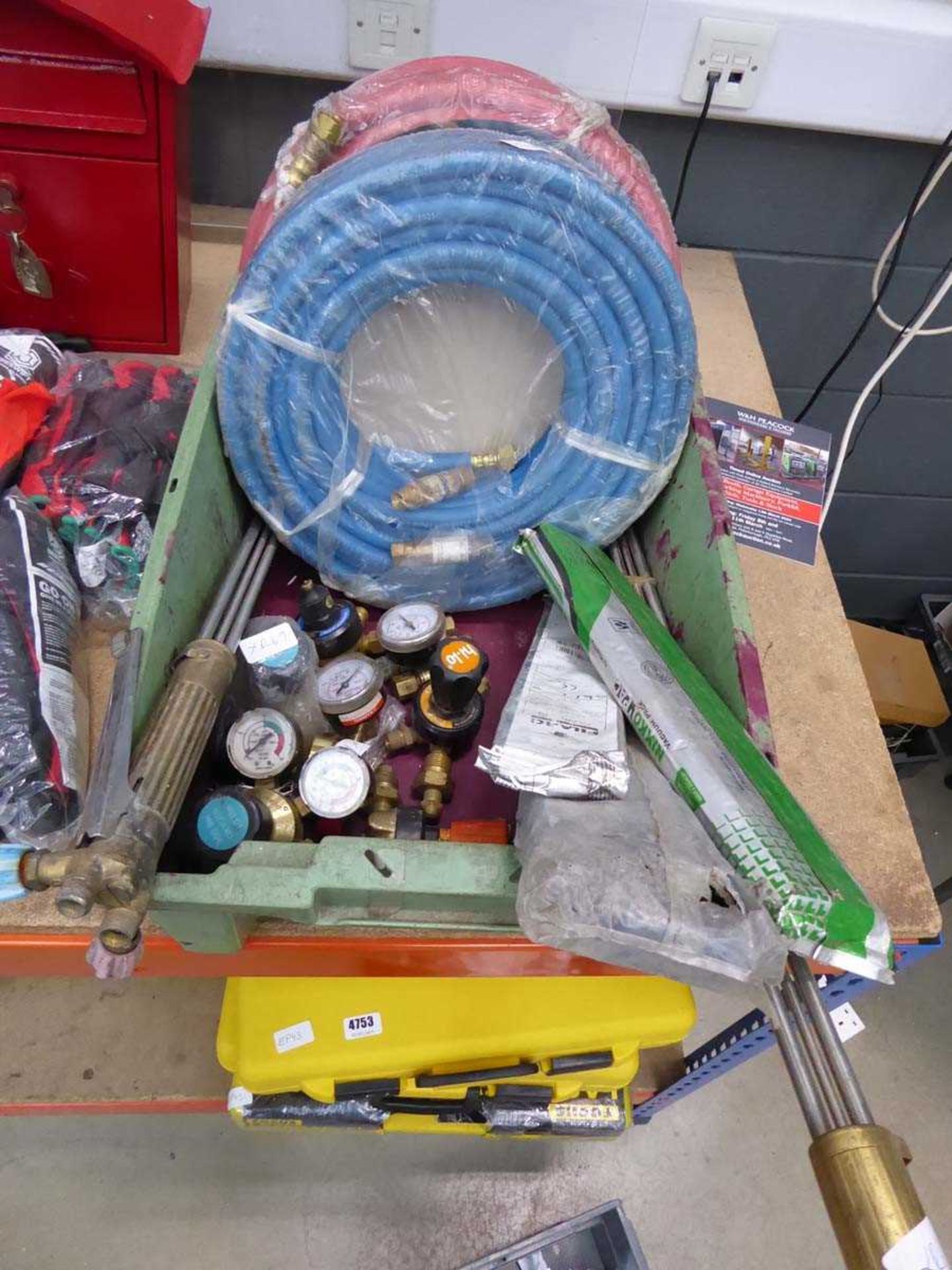 Box containing welding torches, regulators, hoses, welding rods, etc