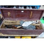Wooden toolbox containing vintage woodworking and other tools