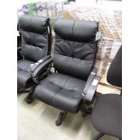 High back black swivel armchair