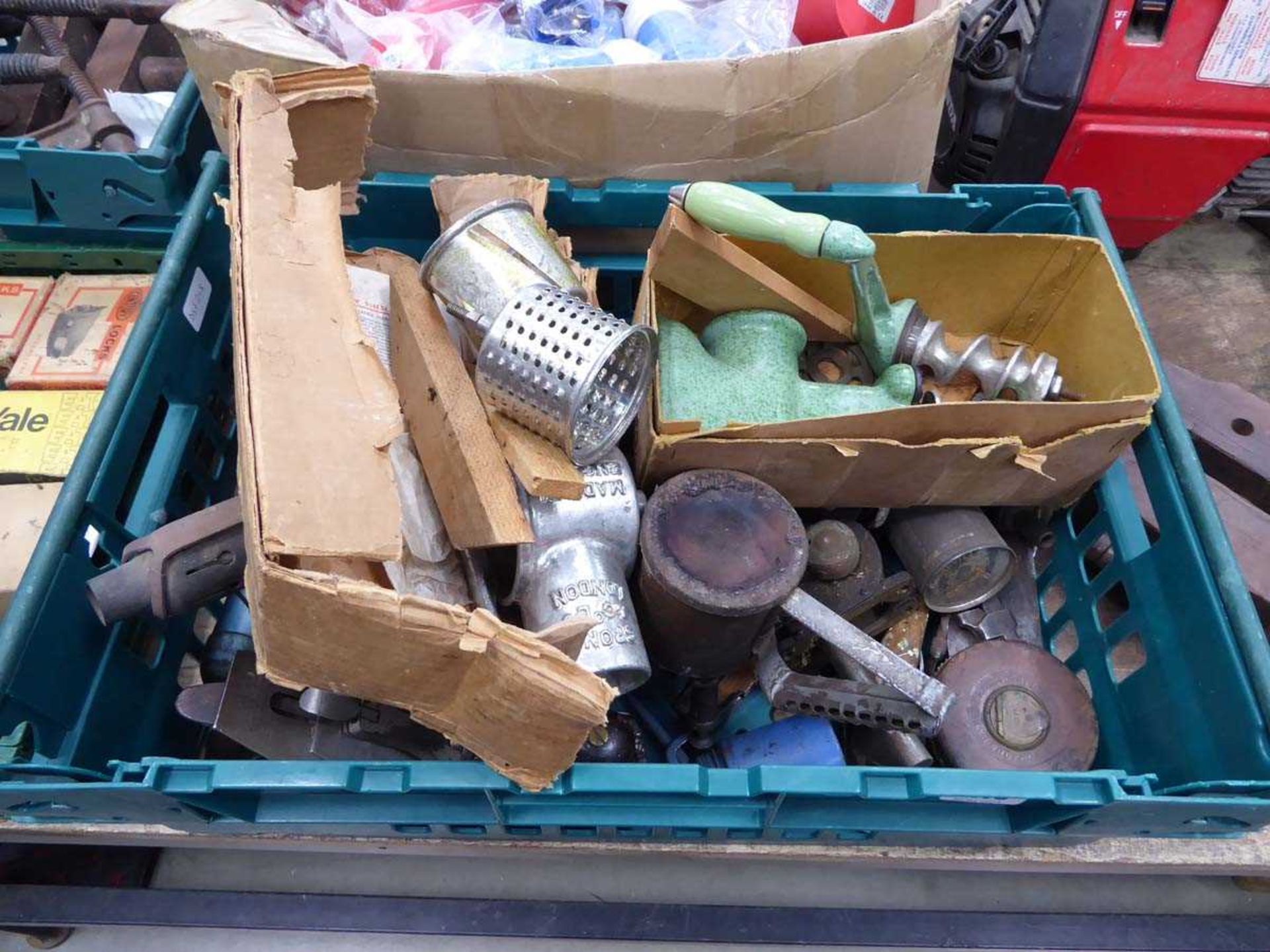 Box containing a mincer, vintage planes, tape measures, oil cans, etc