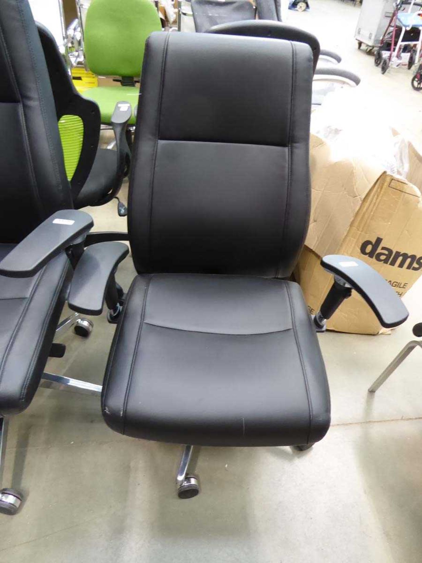 Black high backed swivel armchair