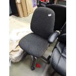 Black cloth swivel chair on black base