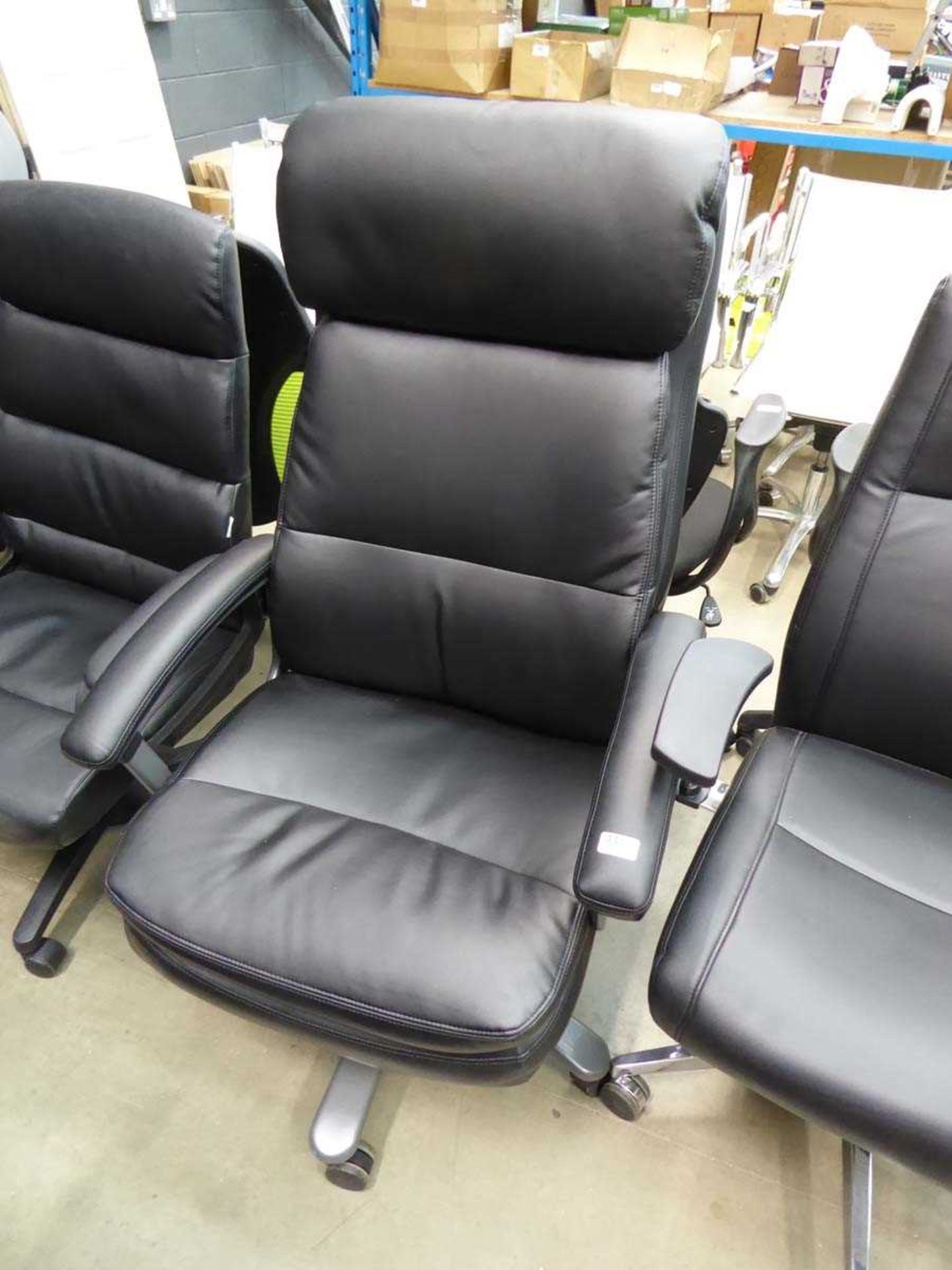 Black high backed swivel armchair