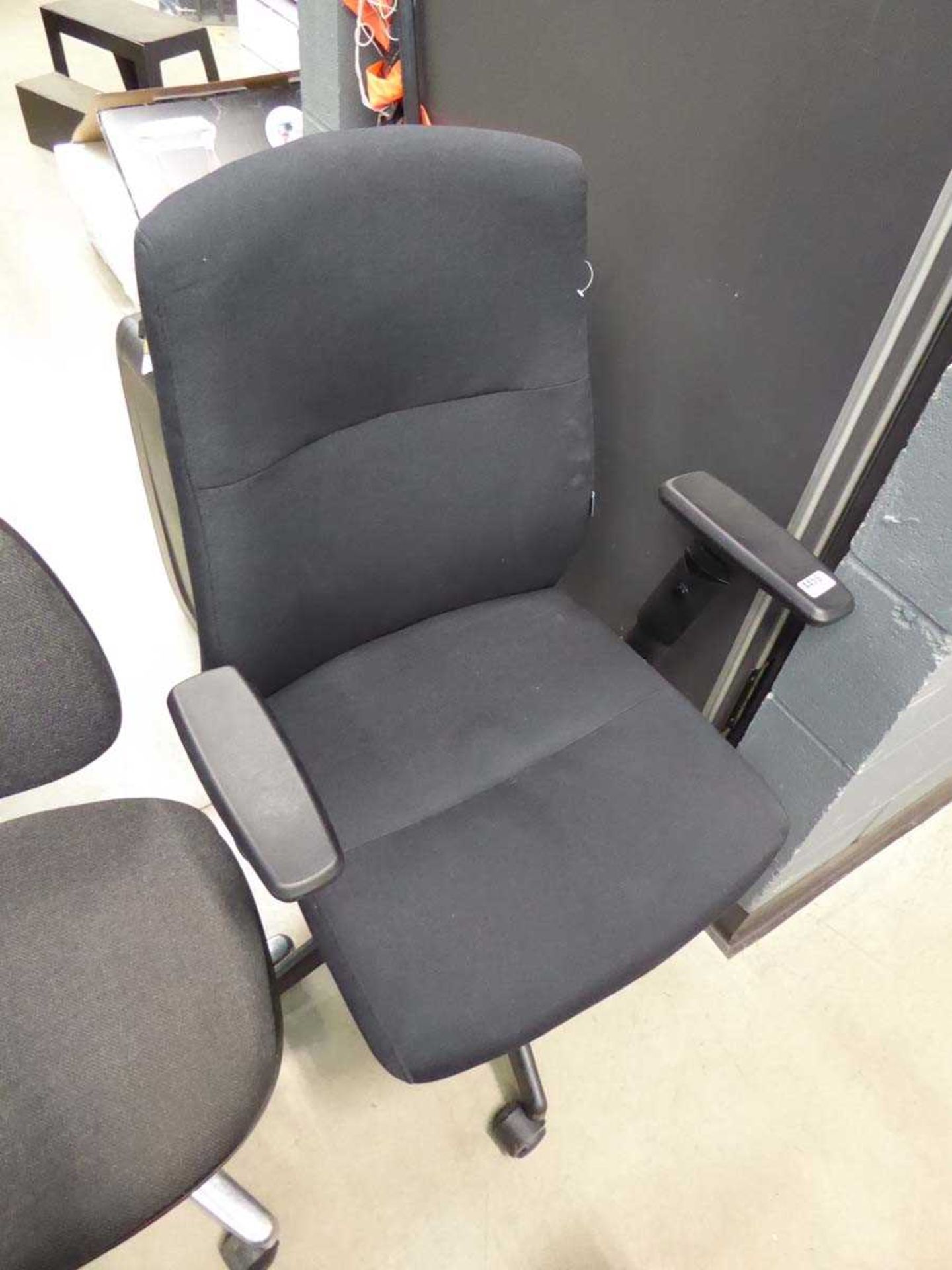 Black cloth swivel armchair