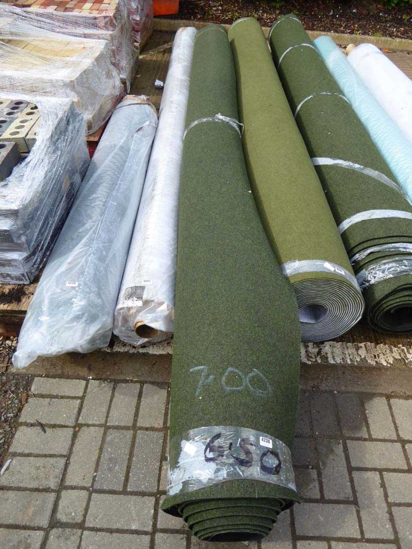 Approx. 6.5m roll of green industrial style carpet