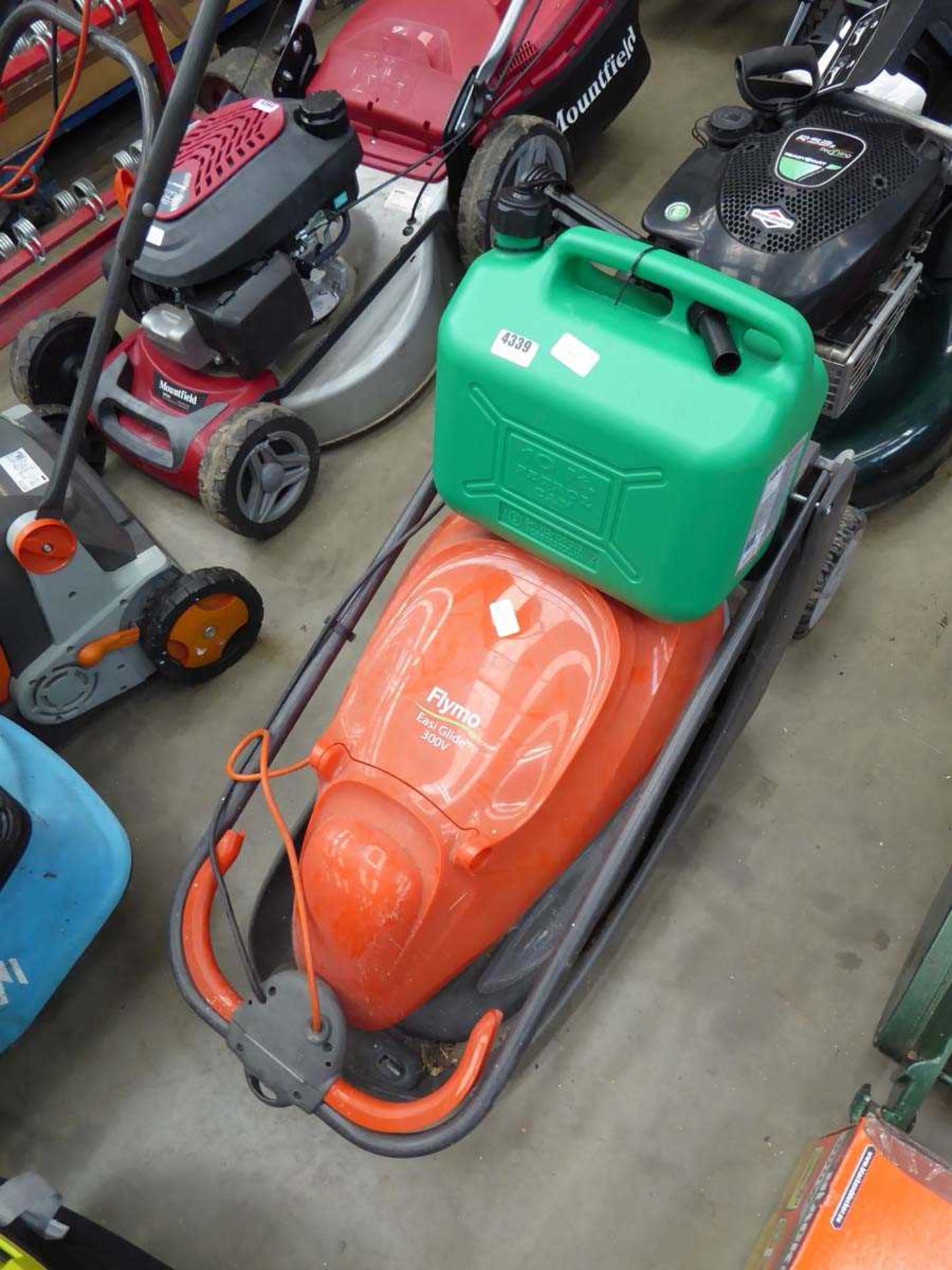Flymo electric mower and a green fuel can