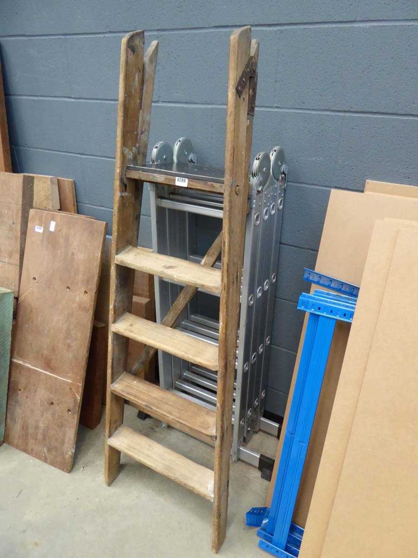 Wooden step ladder and a multi position ladder